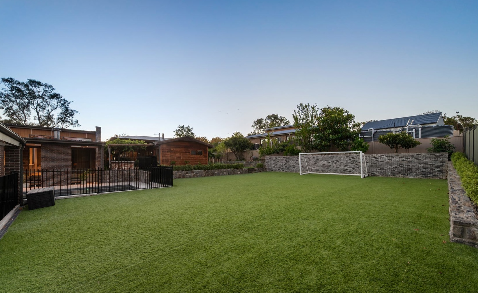Luxury wood cabin with soccer pitch listed in heritage town where homes rarely sell